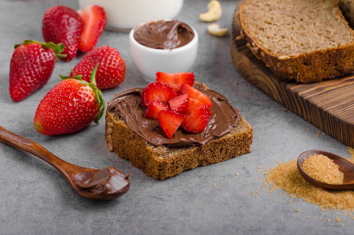 Add chocolate hazelnut spread and sliced strawberries to a piece of your favorite homemade bread 🍓 #MyBreadman