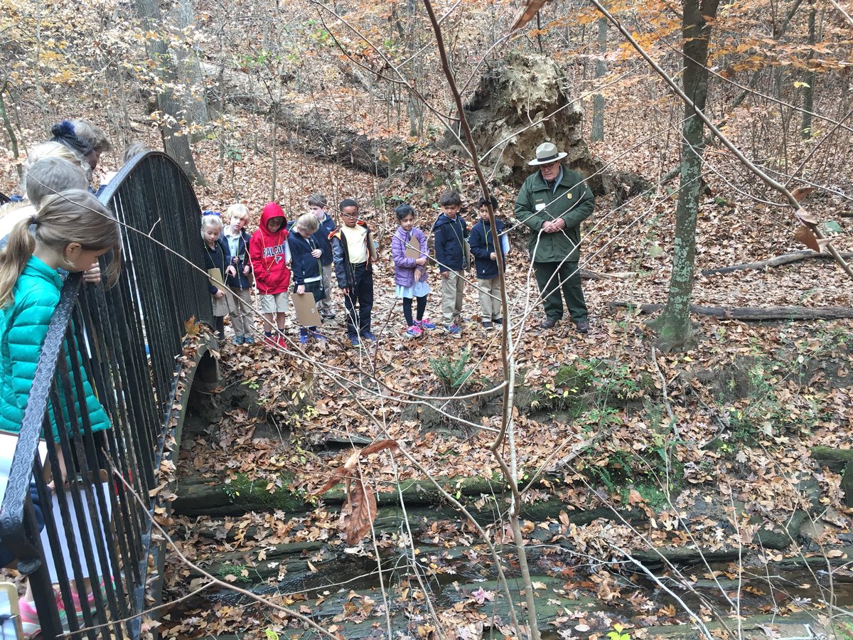 julabbie's tweet image. First grade explorers head boldly into Discovery Woods with Park Ranger Jerry Hightower #Trinitylearns