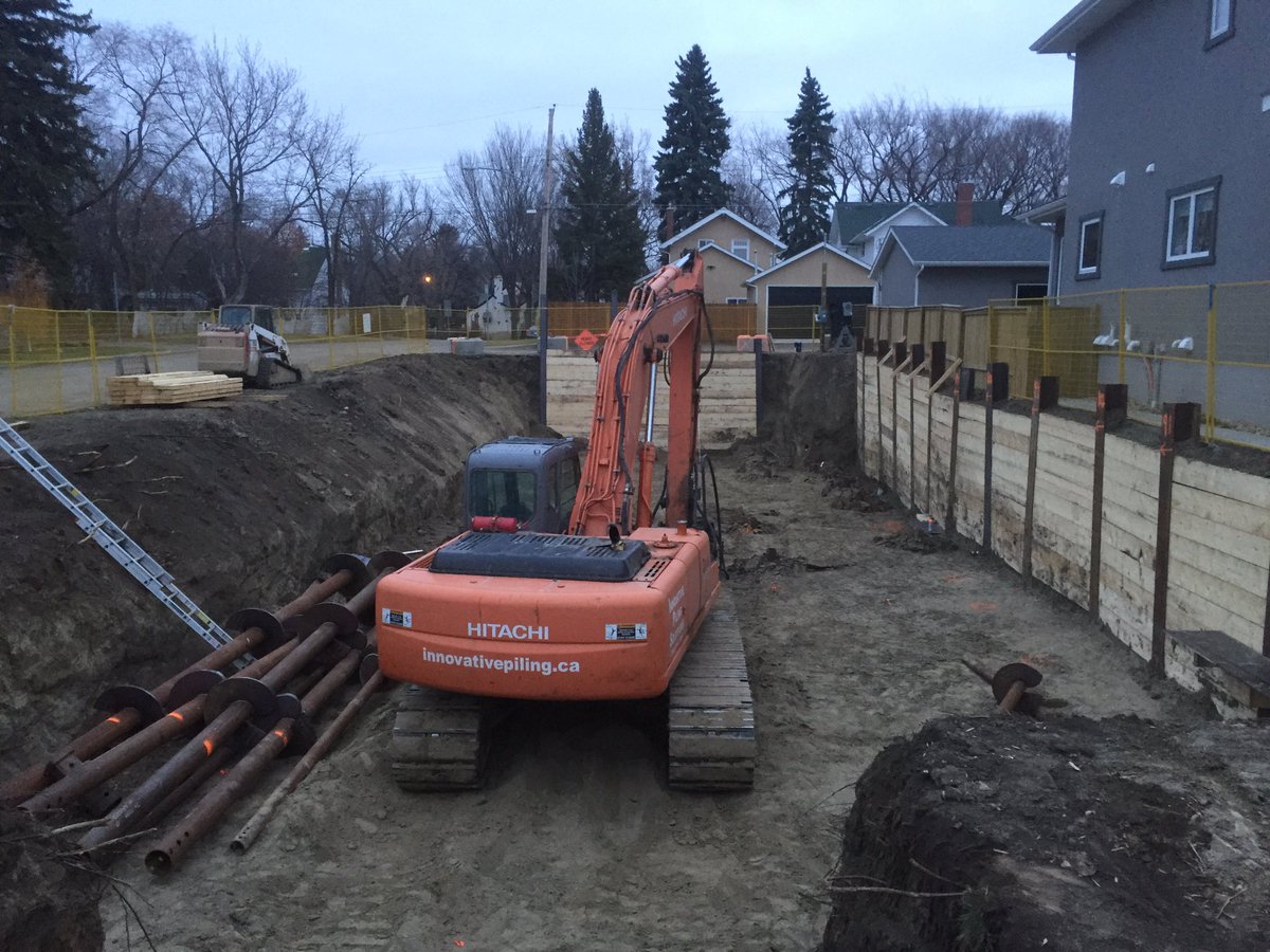 SaskPiling's tweet photo. Residential to industrial capacity screwpiles a phone call away! Here are some examples where IPS had to design and install driven H-pile and lagging shoring prior to the design build screwpiling #oneandonly #drivenandhelical #skbuilt #screwpiles #drivenpiles @PilingCanada https://t.co/KmnS1qKSsX