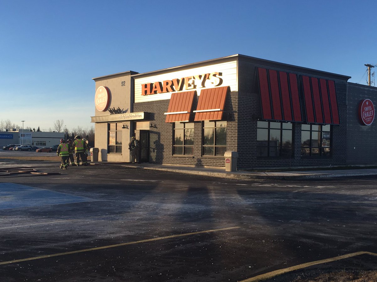 GarrettBarry's tweet photo. Firefighters at the Swiss Chalet in Gander. Police say no one inside. #cbcnl https://t.co/Pb2fvP01Hi