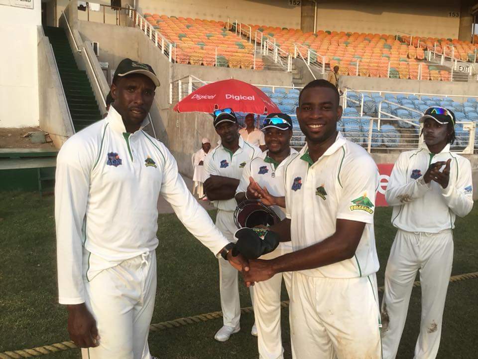 WindwardsV's tweet photo. The 23 year old Kenneth Dember made his first class debut for the Windward Islands Volcanoes, in the 5th round PCL four day match vs the Jamaica Scorpions at Sabina Park, Jamaica. 
Shane Shillingford presents Kenneth  Dember with his cap. https://t.co/22ZNwuRcii