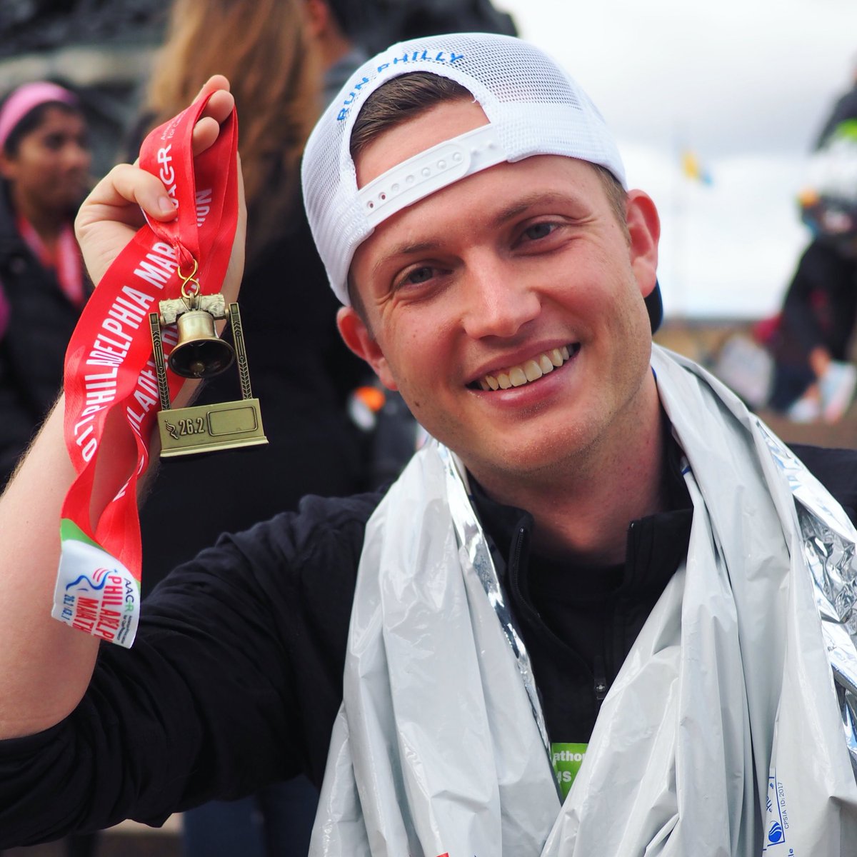 Me, very tired and sore, holding a goddamn medal 🏅