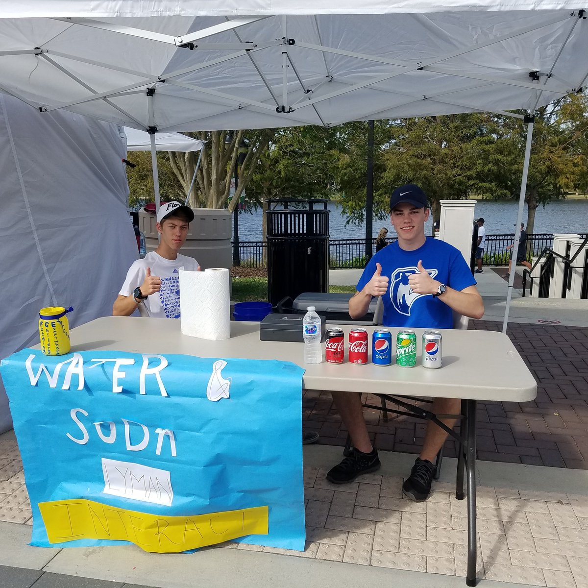 Kyler and Griffin working hard at the interact booth at the arts and wine festival!