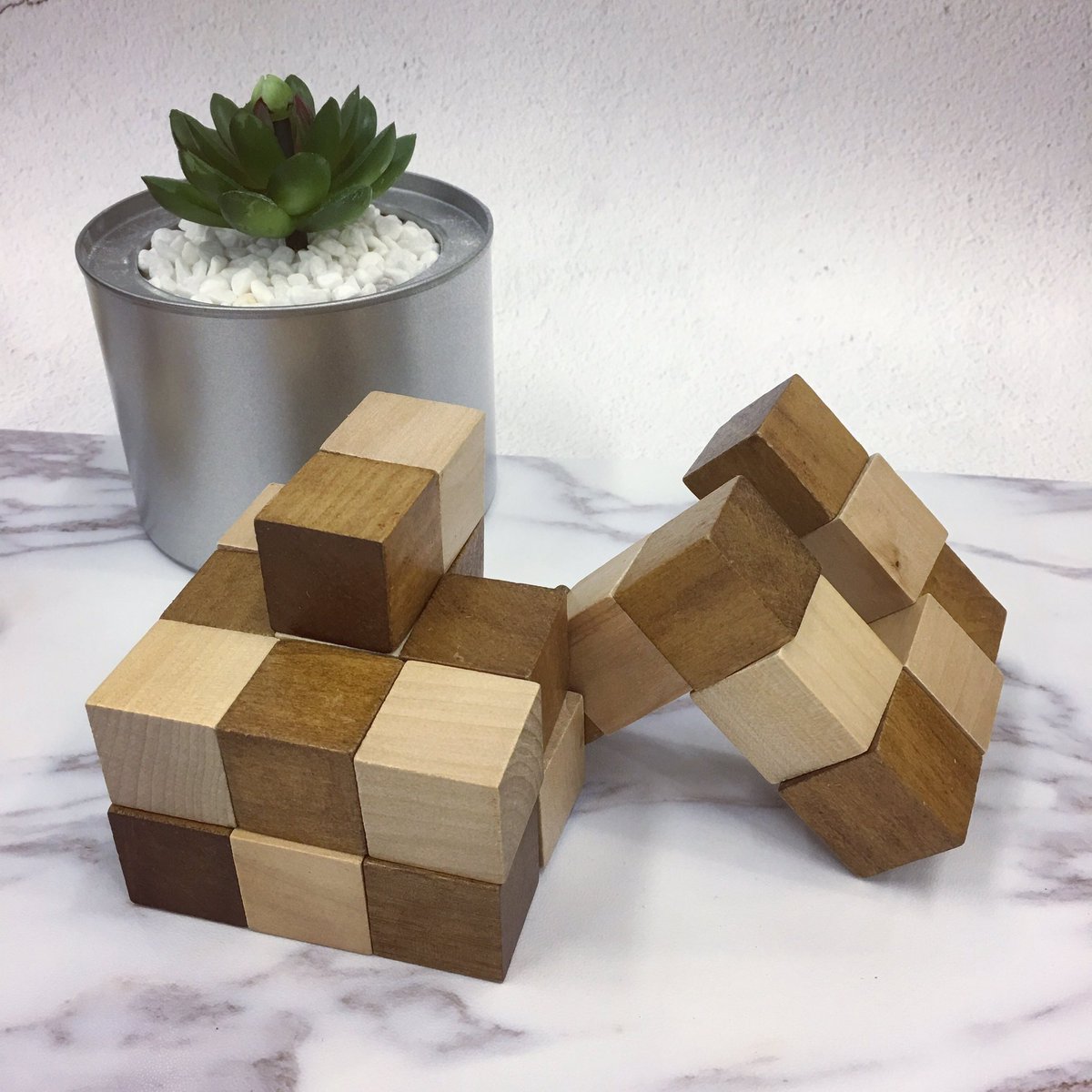 puzzlemaxcom's tweet photo. Snake cube is definitely a good gift option for kids. 🎅🏻It is so simple but yet logical. #stem #stemtoys #education #logical #snakecube https://t.co/Y3V58FILHy