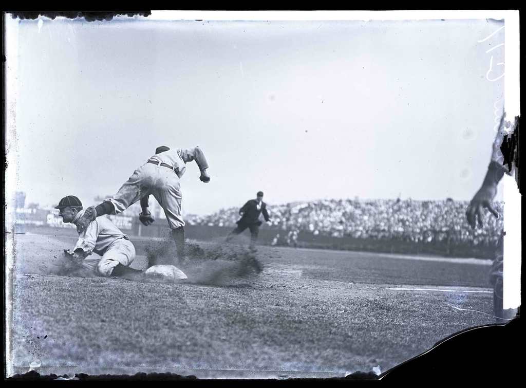 Picture of Ty Cobb in 1910 sliding into third