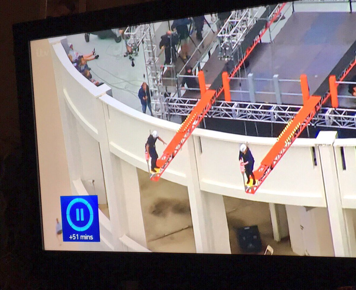 sammi_doodah's tweet photo. @imacelebrity who is the person running on the bottom left of the first pic? The second pic clearly shows there's nothing there? No terrace or building nothing 🤷🏼♀️This building stands alone in other shots #IsItFake? #imaceleb #FlyingHuman https://t.co/hj8X40NqKP