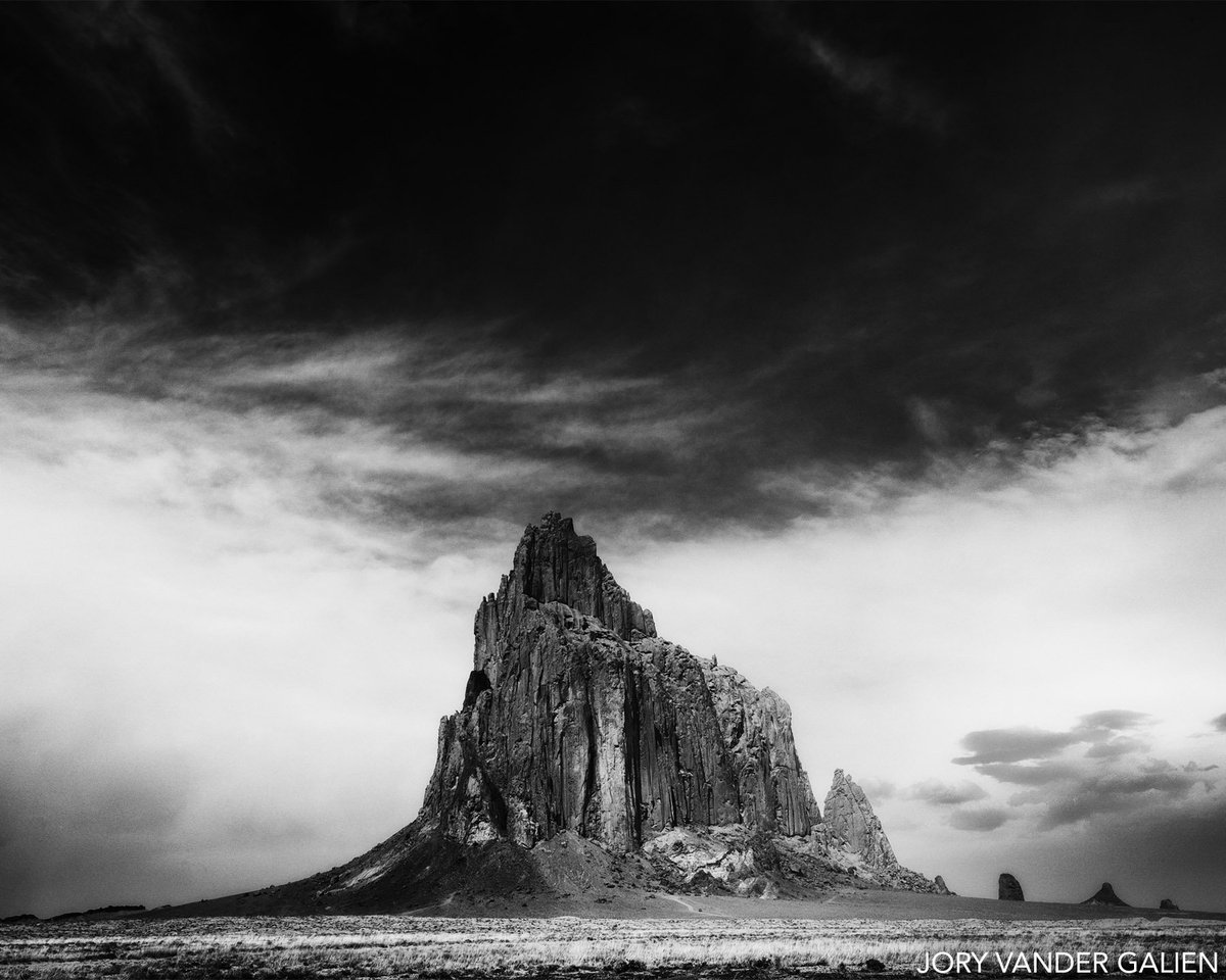 theg2gallery's tweet photo. How spectacular is this photograph by @joryvgphoto on view in our #DesignedEnvironment exhibit? Jory has vigorously studied Ansel Adams. His main subject is the wide-open desert, like this image taken at #Shiprock, New Mexico. #G2Artists #G2Exhibits  #BlackandWhitePhotography https://t.co/7w1al9Asxe