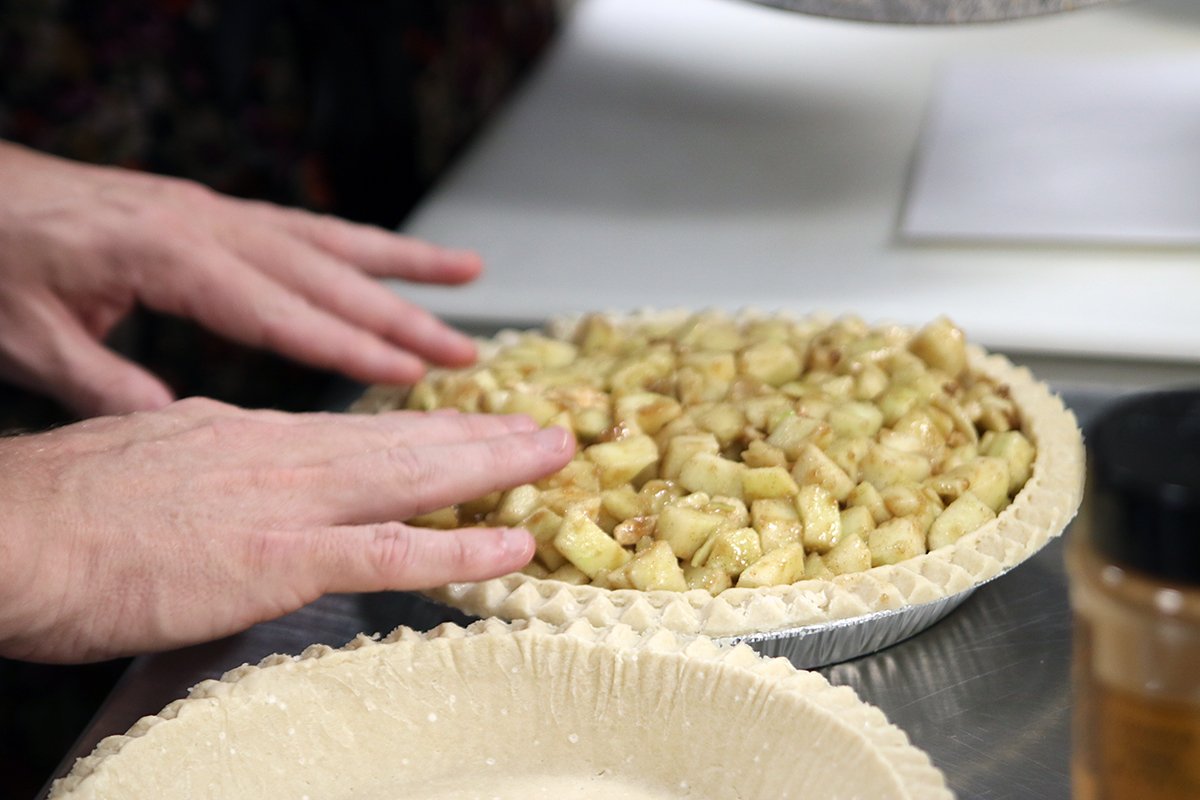 JFSSD's tweet photo. #TeamJFS is hard at work baking homemade apple pies for the @MamasKitchenSD Pie in the Sky bake sale, helping individuals with critical illnesses sit down to delicious meals. https://t.co/IsXGl0Bd8e