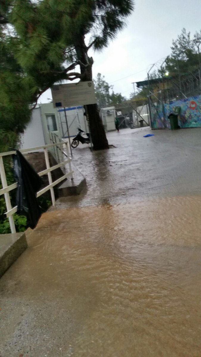 MSF_Sea's tweet photo. #Vanthy "Reception Centre" is waterfront property after storms hit #Samos yesterday. Somewhere between 1,704 and 2,137 cold, wet, vulnerable #people are living here in facilities meant for just 920. Seriously, this is too much #OpenTheIslands. https://t.co/GDIbTeSckp