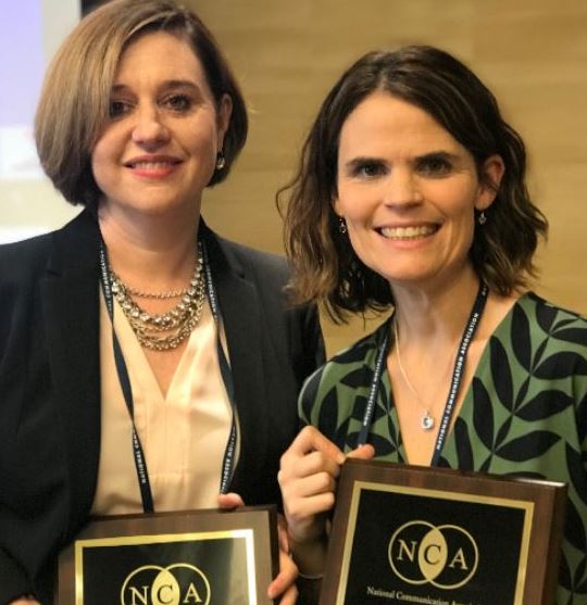 LambSchool's tweet photo. The Lamb School won big at last week's @NatComm Conference. Dr. Melanie Morgan was awarded the Dan Yoder Distinguished Faculty Award, and Dr. Jen Hall accepted the Basic Course Program of Distinction Award. https://t.co/vdysiRbkbG