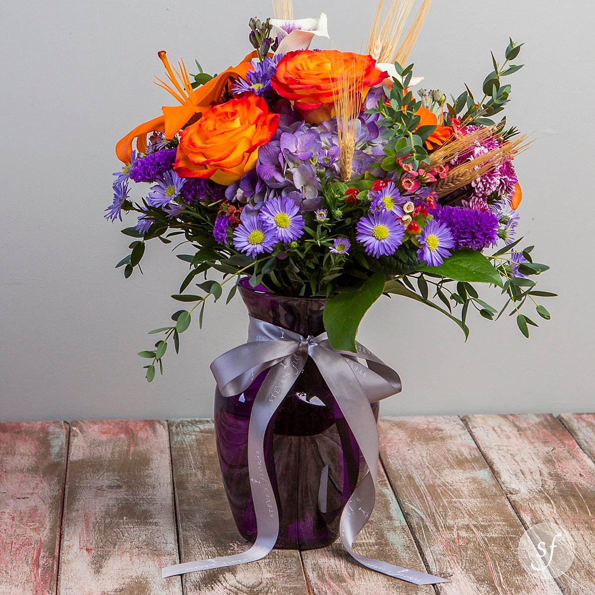 StevesFloralKS's tweet photo. Ignition is an energetic combination of warm and cool colors accented with foliage and wheatgrass in a purple vase! https://t.co/Pqeire22YW #StevesFloral #Manhattan #Florist https://t.co/2rKL8NxBD1