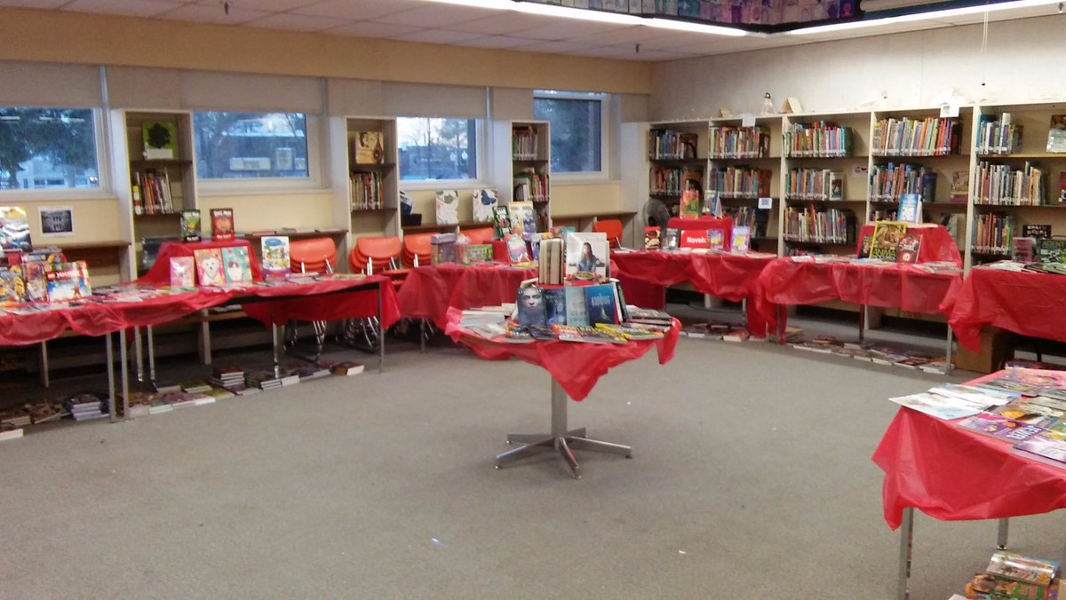 Getting ready for Book Fair while staying open for borrowing.  Transforming the library. #spstl Love the excitement students have for books!