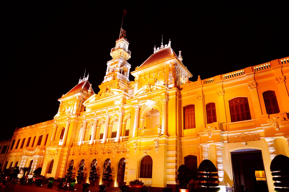 UN_Women's tweet photo. #16days activities have already started! 
Ho Chi Minh City joins us to #orangetheworld by lighting up the People’s Committee building in orange, showing its commitment to ending violence against women. https://t.co/2K9ShEG2Hl