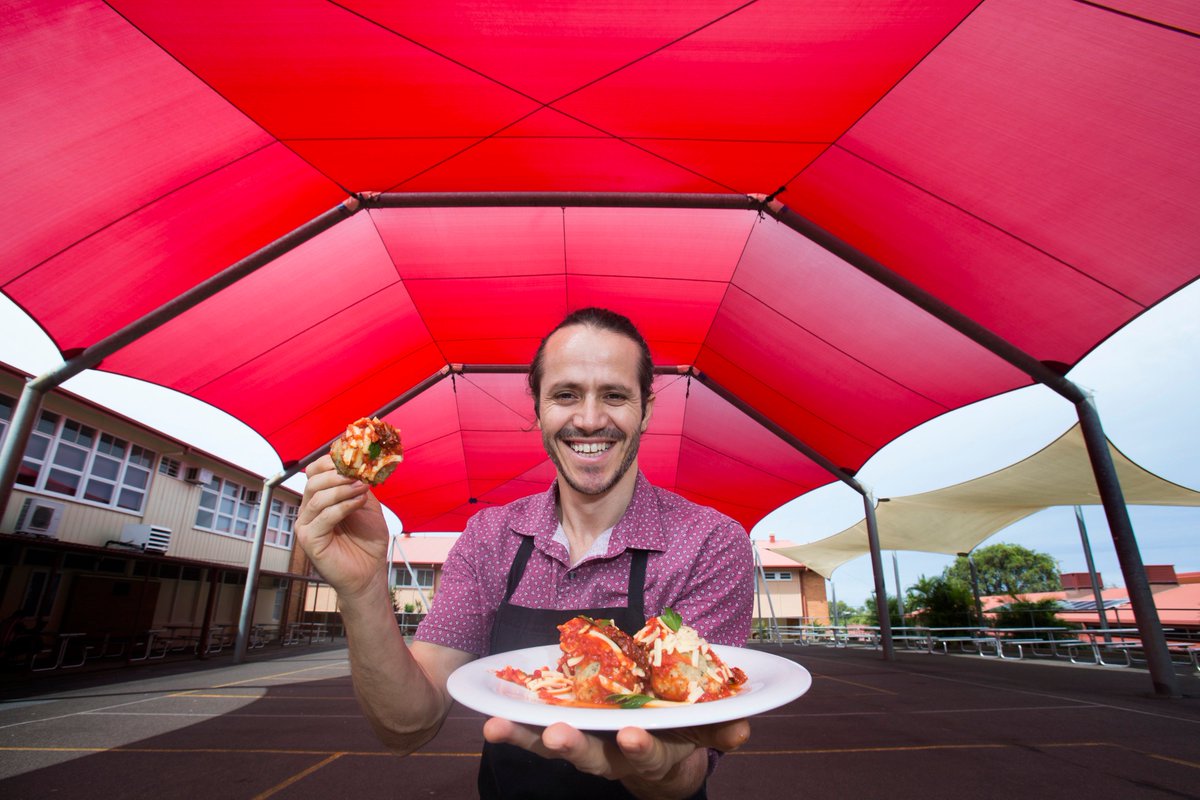 There is still a few hours to go on #SnapBrisbane day! Snap, hashtag and share now. Here we have a striking photo of Enton Shaho, the tuckshop convenor and chef at Mount Gravatt State High School. Picture: AAP / Renae Droop snapbrisbane.com.au