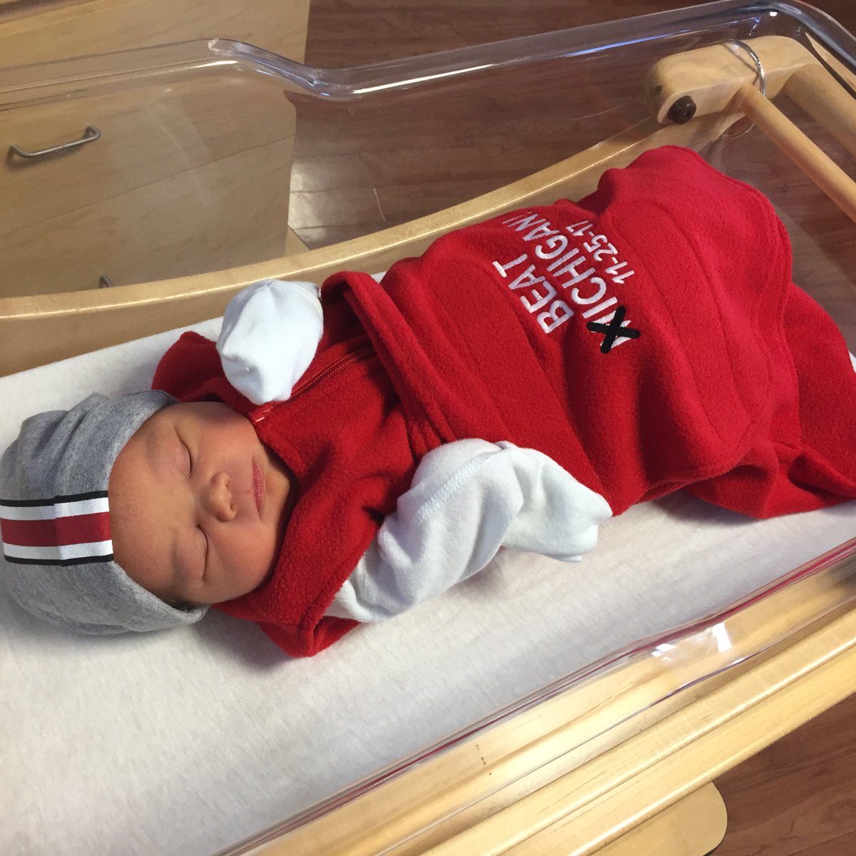 OSUWexMed's tweet photo. At #OSUWexMed, we have the cutest fans in the land! This week (11/20-11/25), all #BuckeyeBabies born at our hospital will receive a "#BeatMichigan" sleep sack &amp; hat to wear while they cheer on @OhioStAthletics this Saturday! #GoBucks #BeatTTUN https://t.co/8dcn5yZKI0