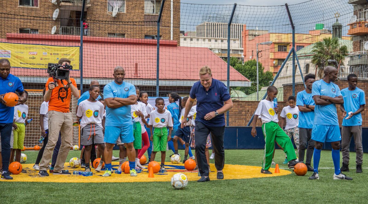 RonaldKoeman's tweet photo. Great start of the South Africa trip with the @JCFoundation. We re-opened the Orange Cruyff Court Hillbrow today. Priceless to see all these kids' happy faces! #becauseactivechildrenmoveup #CruyffLegacy https://t.co/XkXgBWBp60