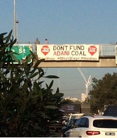Alan_Cuthbert's tweet photo. It's day 4 of our 5 day campaign -the #StopAdani  banner on 5 freeways in 5 days. We are on the footbridge in Clifton Hill over the Eastern Freeway.   Let's stop  ADANI! #5Days5Fwys #QuitCoal #5Days5Fwys https://t.co/qtuGldsJMJ