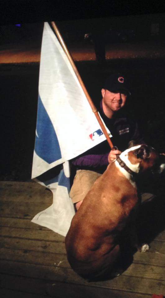 Matt9Stevenson's tweet photo. My boxer Wrigley was a born @Cubs fan and was until his dying day. My favorite pic of us flying the W after last seasons world series title. https://t.co/YKMRG3c3BV