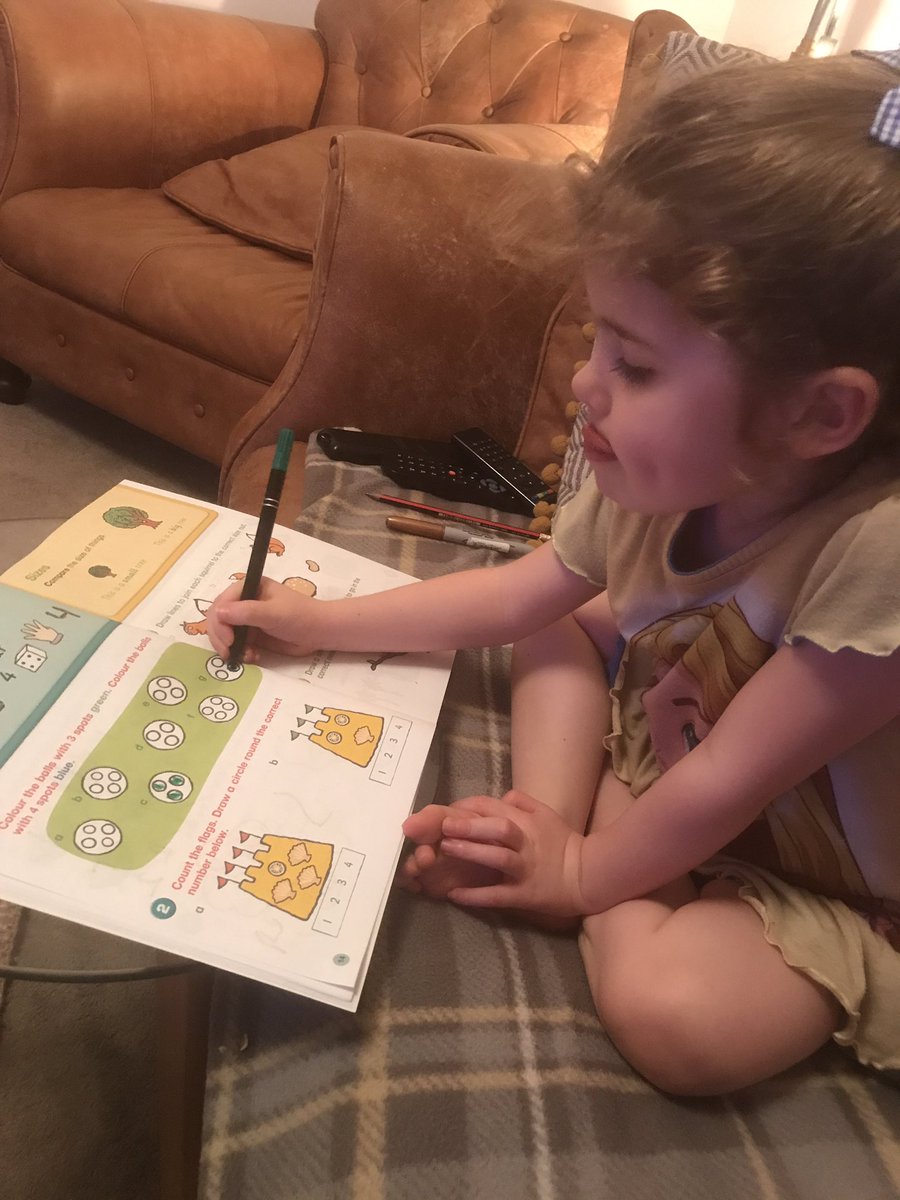 She's concentrating her tongue is out... doing her learning activity book before bed <a href="/KellingtonSch/">Kellington Primary</a>