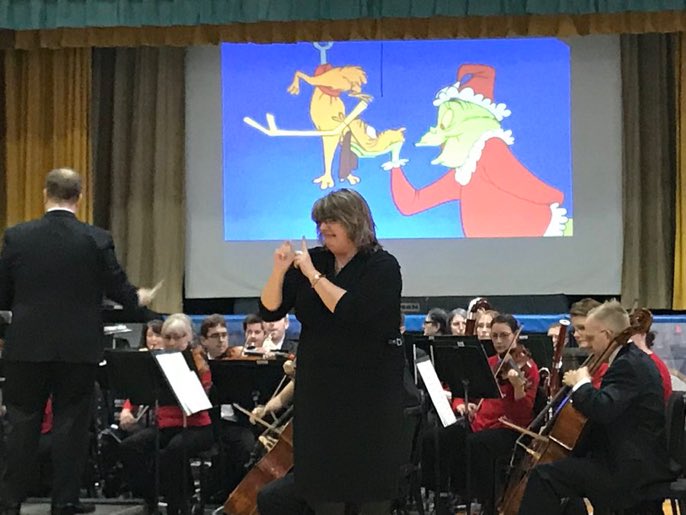 SMSDBuffalo's tweet photo. Sign Language Educator Pamela Rohring performs You’re a Mean One, Mr. Grinch at the Holiday Concert. #SMSDpride @4201Schools #Thankful https://t.co/eAeeeqTDUs
