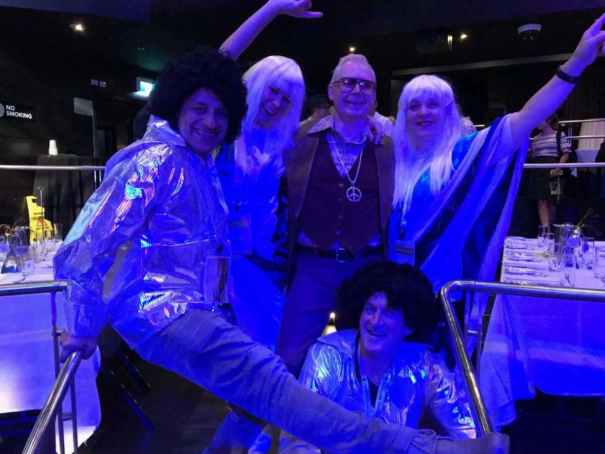 WavesoundAUS's tweet photo. #SWITCH2017 It's the Disco 70s dinner at the conference! Our Sales team shouldn't give up their day job...what do you think? I also spy a Riverina librarian in there.. https://t.co/TefQpoH2JO