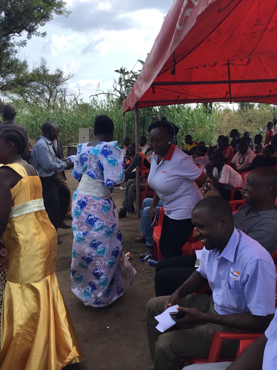 CocaColaBevUg's tweet photo. Our public affairs and communications manager Maureen Kyomuhendo joins the dance session from the natives. #CocaColaShares @WorldVision https://t.co/01XuyKzpXE