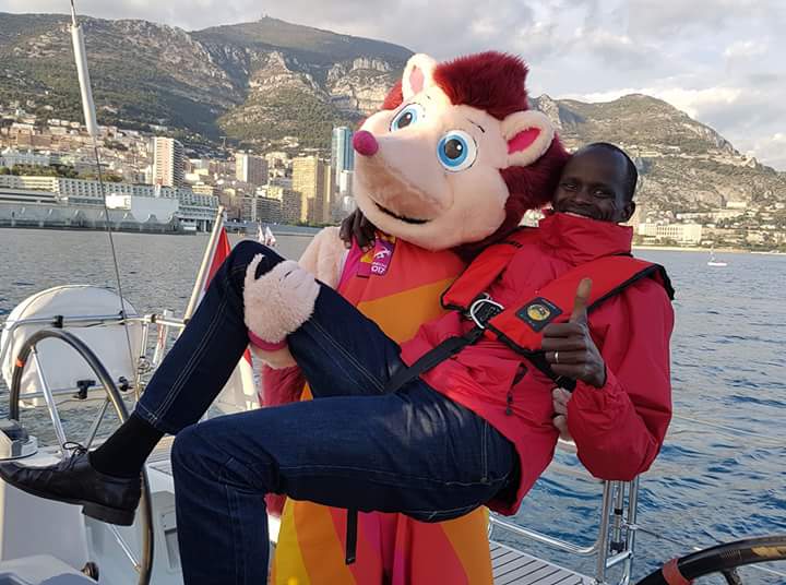 RunEmilyERun's tweet photo. Surreal photo of the day: Mary Keitany's lovely husband Charles Koech with Hero the Hedgehog in Monaco! https://t.co/tBEAPdTu13