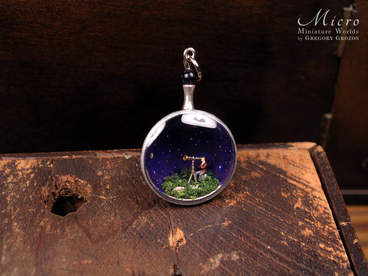 GregoryGrozos's tweet photo. One of my miniature world pendants. A tiny astronomer is observing the cosmos through a tiny telescope. To be found at: https://t.co/GFkhFUY4ho https://t.co/zZBfqlsCeg
