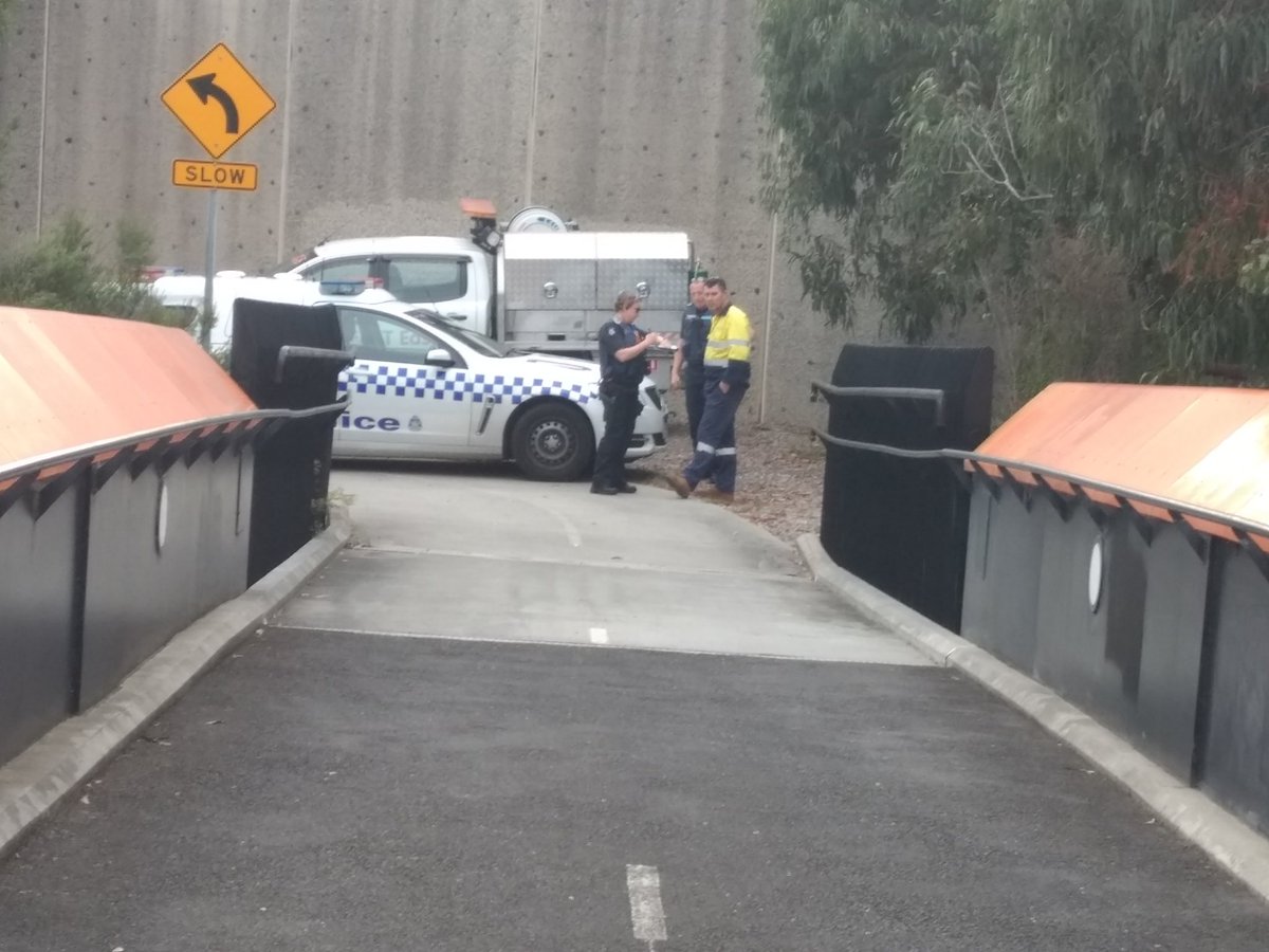 Alan_Cuthbert's tweet photo. Police arrived and asked us to take down our Stopadani banner from the Orange footbridge over EastLink. They then removed it and said if we put it up again they would charge us.  Decided to call it a day. #5Days5Fwys #StopAdani https://t.co/JXwiev1wFy