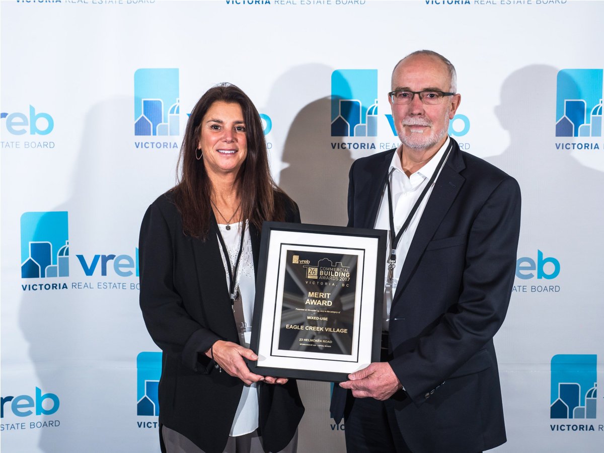 omicronaec's tweet photo. Our Vancouver Island Director, Peter Laughlin, with @udibc Executive Director, Kathy Hogan, accepting the @vreb Merit Award in the Mixed-Use Category for our Eagle Creek Village project https://t.co/YdrhoHJg9g