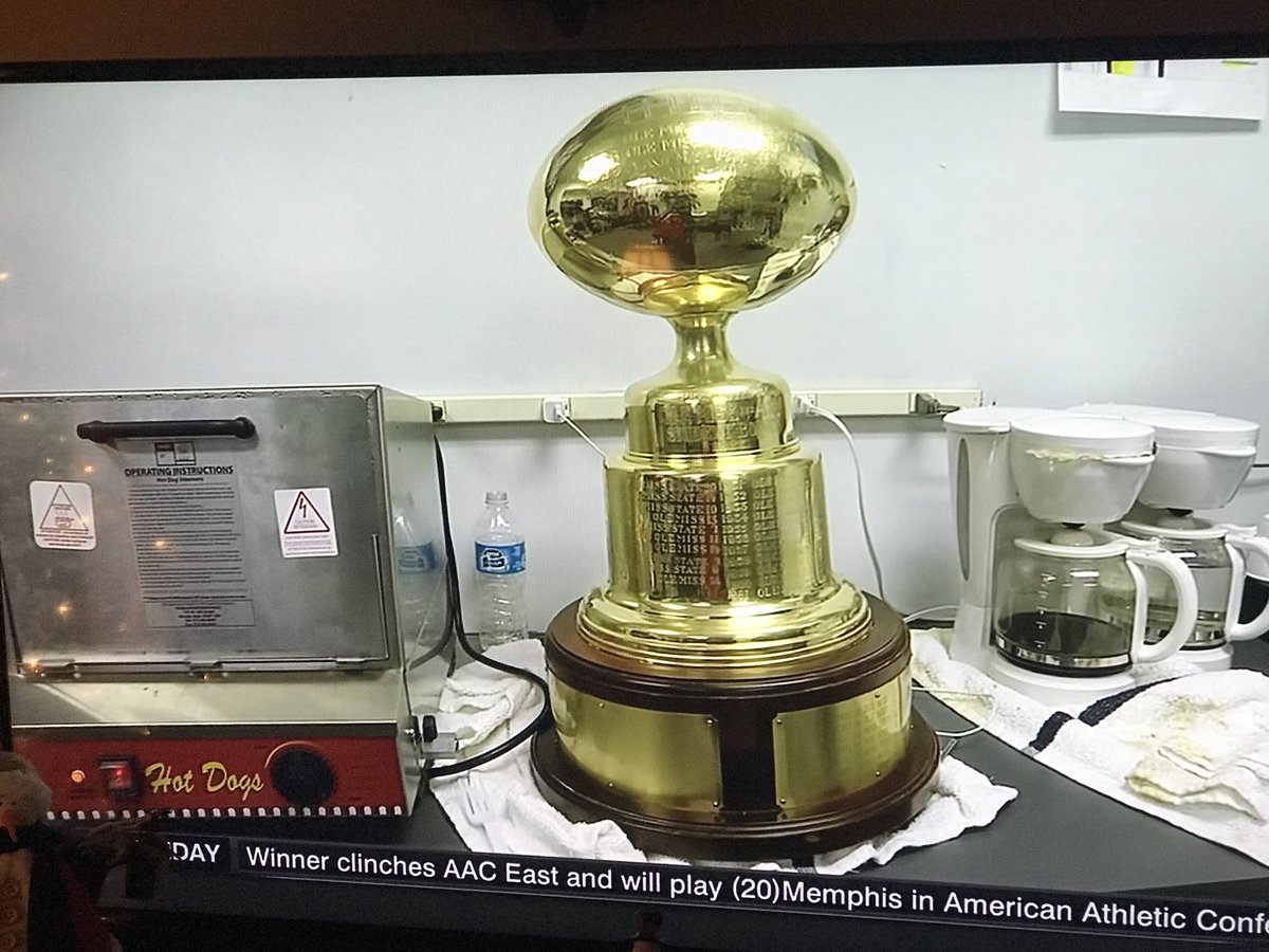 It would appear the #EggBowl Trophy enjoys a good hot dog and cup of coffee