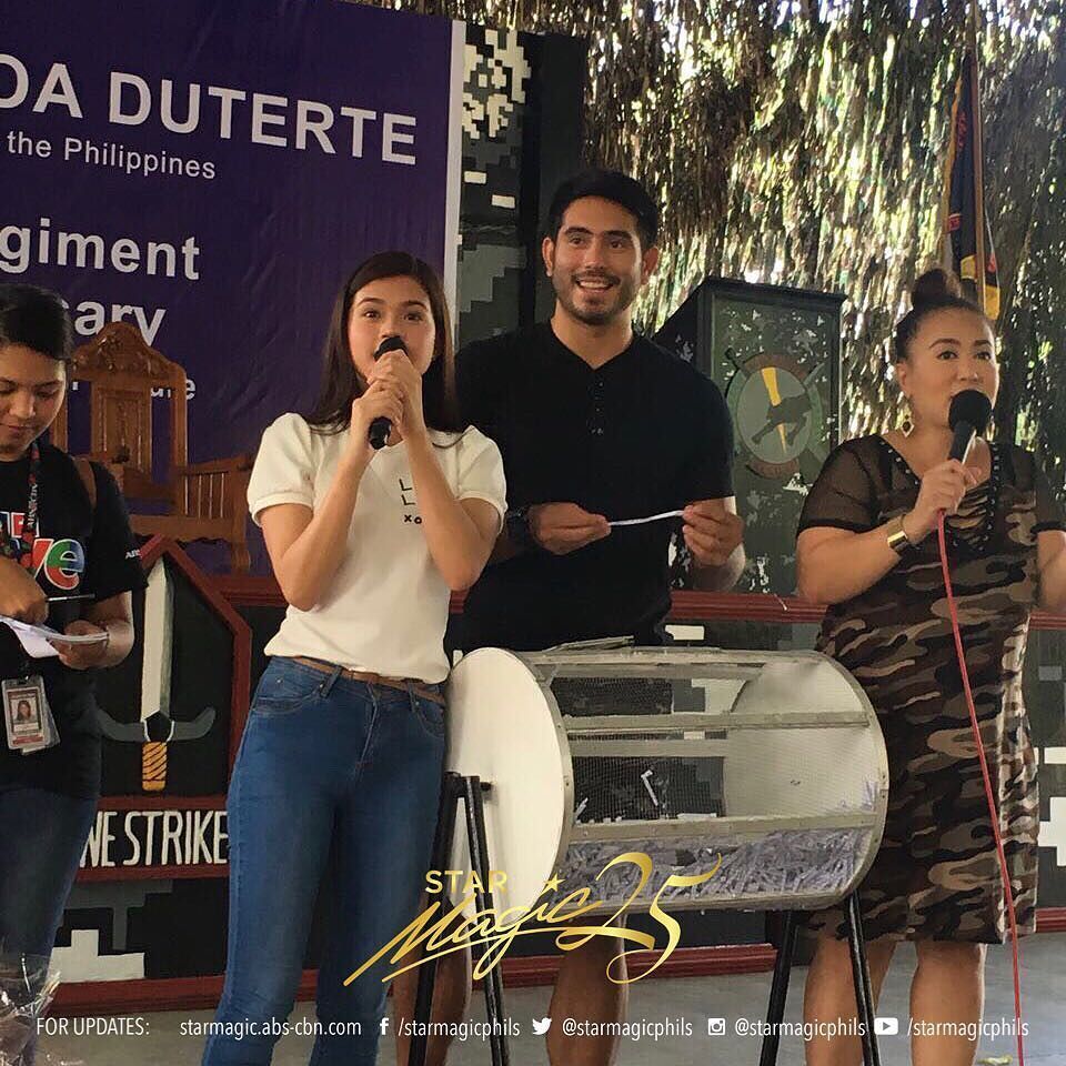 starmagicphils's tweet photo. Gerald Anderson and Maris Racal at the 67th Founding Anniversary of the 1st Scout Ranger Regiment in Camp Tecson San Miguel, Bulacan. Together with the staff of GMO Unit share their time honoring the Heroes of Marawi, as they listen to their stories and bravery. Salute to you! https://t.co/51FQiFc8z9