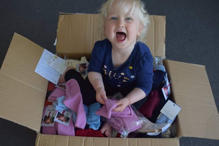 LittleSproutsNZ's tweet photo. An enormous thank you to @cosytoessocks for donating this huge box of merino socks! (Btw - happy wee girl was added after box was opened) https://t.co/AMQWvfBznR