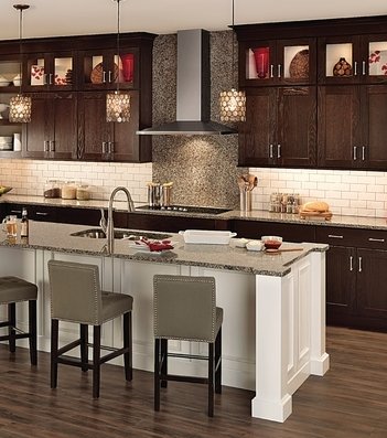Designer Tip: Contrasting white backs in the wall cabinets provide a unique look , lightening up the dark cabinets.