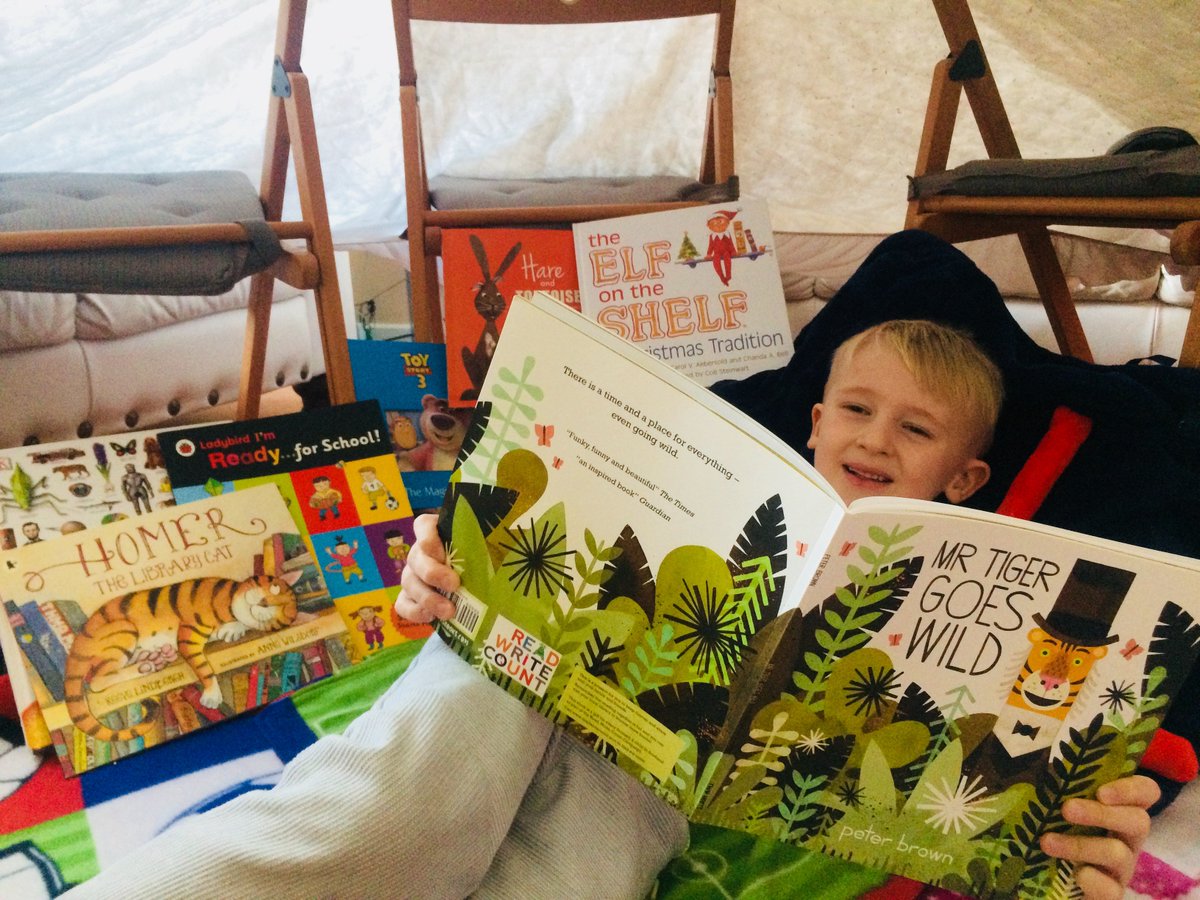 WBurghPrimary's tweet photo. Ethan reading his favourite books in his reading den. #ReadingDares I love the fact you've combined the dares. #BookWeekScotland #WillybugsRead https://t.co/fL1s1ctJxP