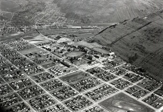 RollinHMcKay's tweet photo. Aerial views of @umontana. The first was taken by #RHMcKay in 1954, well before drones or #snapchat. At the time the #MountSentinel "M" was made of rocks. The second image is contemporary. https://t.co/73cWnm8M5Q