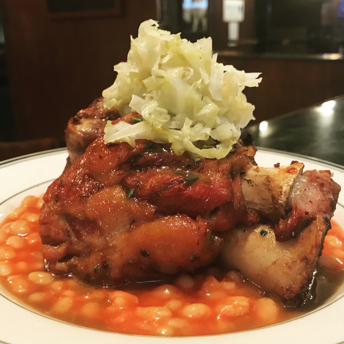 fenianspub's tweet photo. Come get shanked at Fenian’s! Pork & Beans; Pub Ale braised Home Place Pastures pork shank, English style baked beans, pickled local cabbage, braising jus. #eatlocal #eatirish #eatpig #eatjxn #thisisirishfood #getshanked #belhaven #publife https://t.co/x8zuLTf8bd