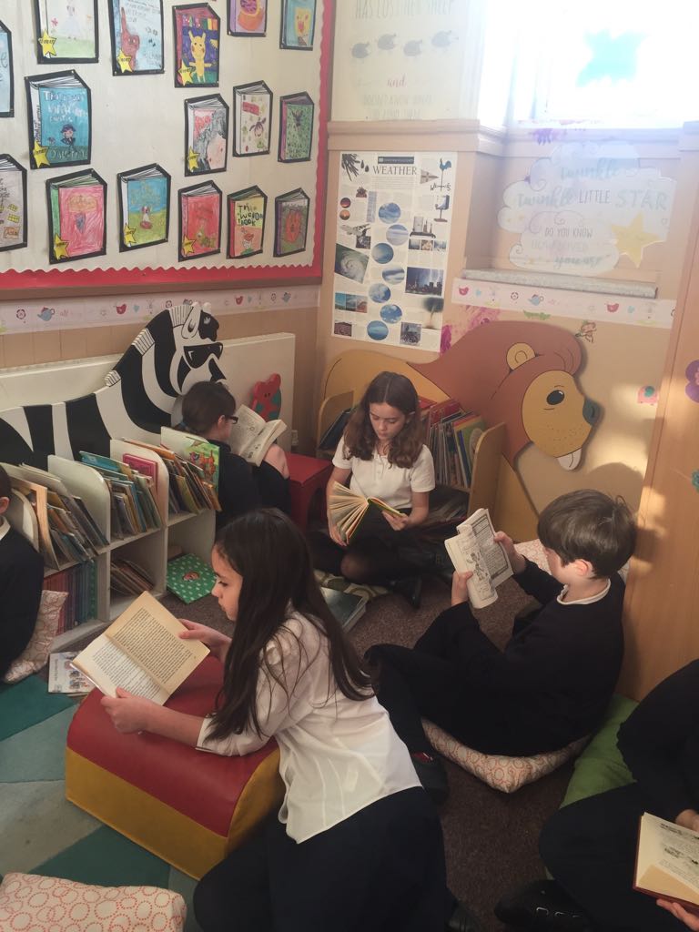 WBurghPrimary's tweet photo. P6 enjoying a biscuit and a good read. #BookWeekScot #WillybugsRead https://t.co/67vslotLyo