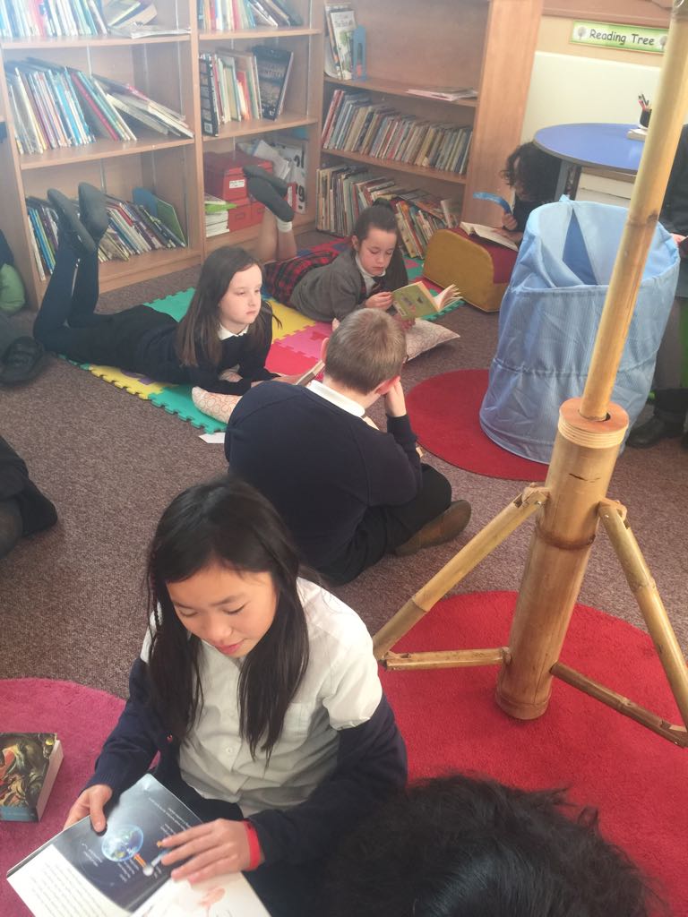 WBurghPrimary's tweet photo. P6 enjoying a biscuit and a good read. #BookWeekScot #WillybugsRead https://t.co/67vslotLyo