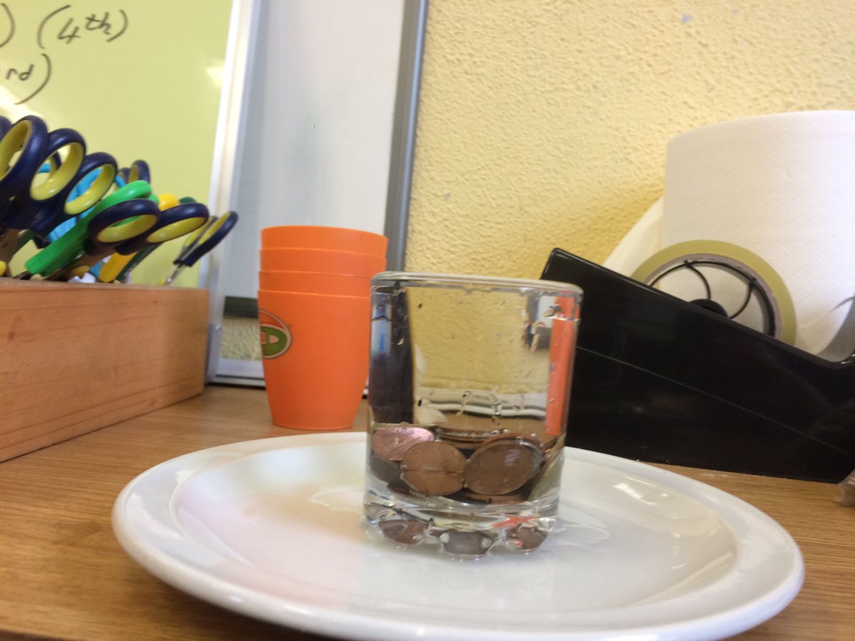 MrsBoyces_Class's tweet photo. We explored #SurfaceTension today. We put 50 small coins in a glass before we broke the surface tension. #ScienceWeek2017 https://t.co/Iu866JUUGk