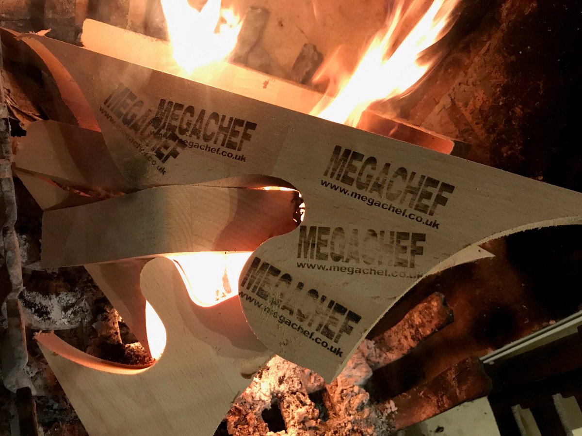 mega_chef's tweet photo. Its chuffing cold tonight! One advantage of having our  Guitar shaped chopping boards made in UK, is that we get to burn the offcuts and branding test pieces!!! please buy some more chopping boards, so we can keep warm!! have a great weekend everyone! https://t.co/ovq4RsmDao
