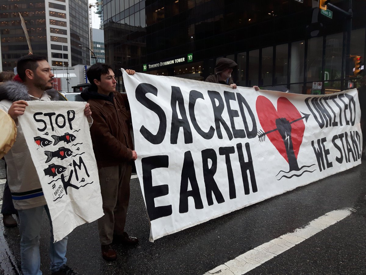 GreenpeaceCA's tweet photo. BREAKING: Flash mob @TD_Canada in Vancouver to #StopKM https://t.co/JemUCJBkQ5