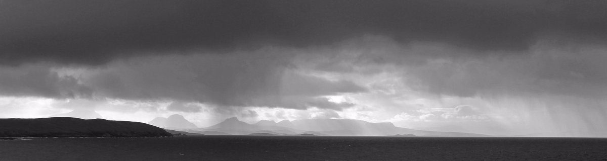 'Brooding;. A brooding October sky over the Atlantic Ocean and hills of Wester Ross. #ThePhotoHour #blackandwhite #Scotland
