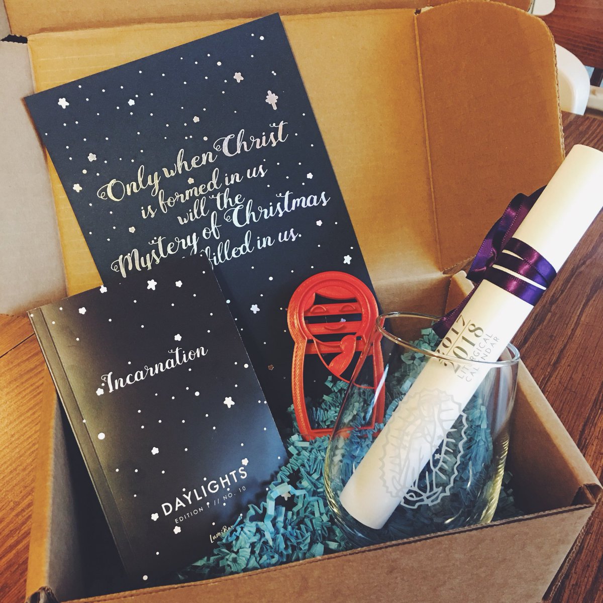 lumiboxcatholic's tweet photo. Couldn’t wait to show off this month’s box 📦 we shipped last week. @telosart Liturgical calendar 📆 @catholiccurio Mary cookie cutter 🍪 Limited edition Our Lady of Guadalupe wine glass 🍷 and custom @lumibox rainbow foil letterpress print to focus you this Advent. https://t.co/HROjLYchsK