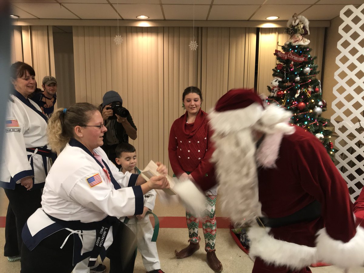 noiambunny's tweet photo. Santa breaking a board at Delmont Jingle Night with Petrillo’s Karate Campus. #delmont #delmontlibrary #santa #Christmas https://t.co/oWQDHGukX9