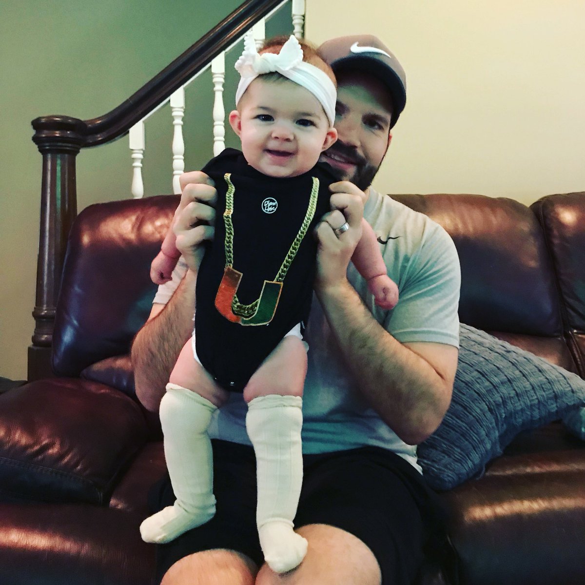 octj52's tweet photo. @marcuslemonis @MiamiHurricanes @CanesFootball @ACCFootball How about a pic instead? Me with my daughter Mia and her TO chain onesie? #gamewithMarcus https://t.co/BtJX8FZ0RB