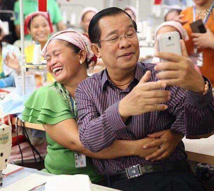 YupeaChea's tweet photo. Cambodian Prime Minister taking selfie with garment workers https://t.co/uliNuAK4Kz