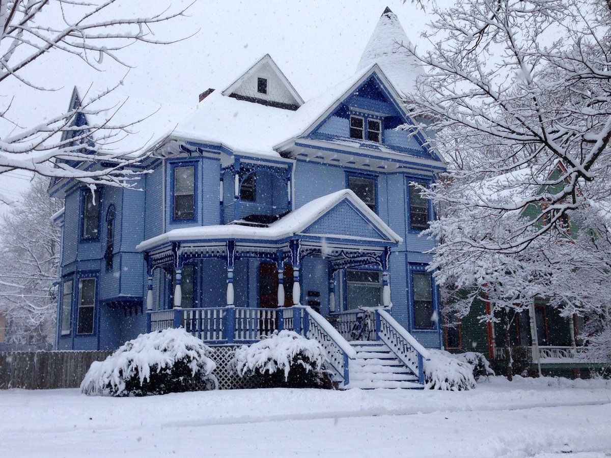 Beautiful blue Victorian in snow