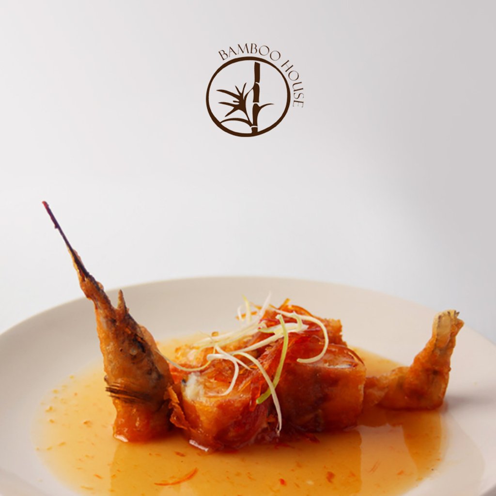 Got Chinese food on your mind? Rolled in prosciutto ham, this boned garfish and prawn mousse dish is a must-try. It is fried in a fluffy batter and served with chilli and kumquat oil. Our chefs have given this dish its nickname, "Rolled Cigarfish." Can you guess why?