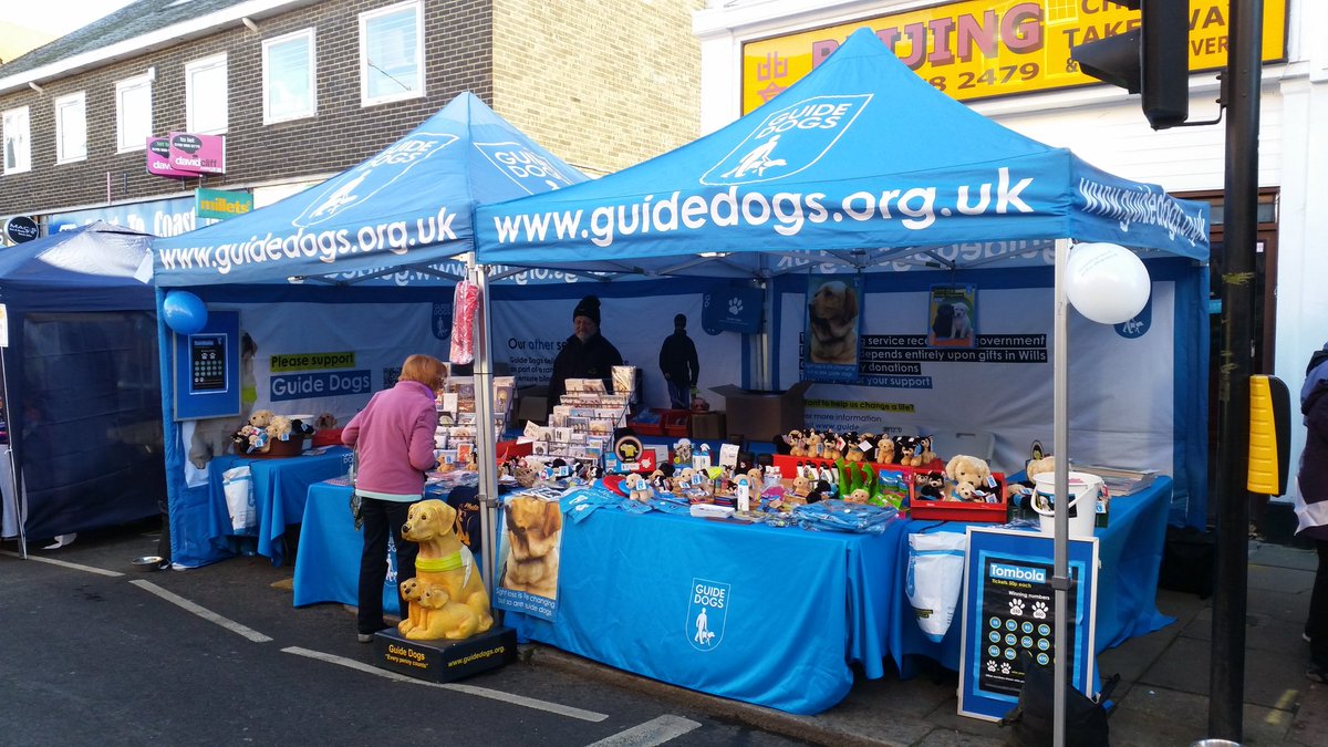 TVGuideDogs's tweet photo. At @WokyWinterFayre   First customer of the day browsing our range of Guide Dogs Christmas Cards. https://t.co/6dr5XPdaJo